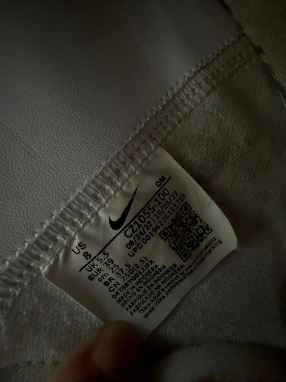 Nike White High-Top Sneakers with Black Swoosh